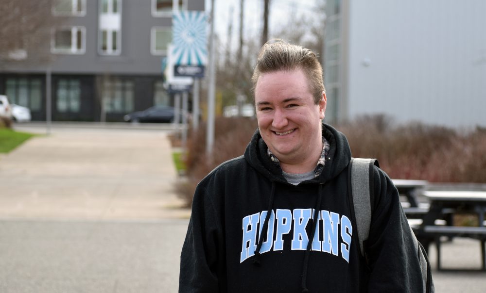 Neamhaim Virtue in SE Campus quad, smiling