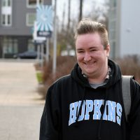 Neamhaim Virtue in SE Campus quad, smiling