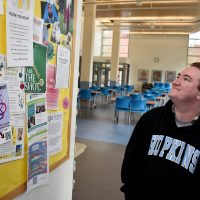 Neamhain Virtue looking at message board.