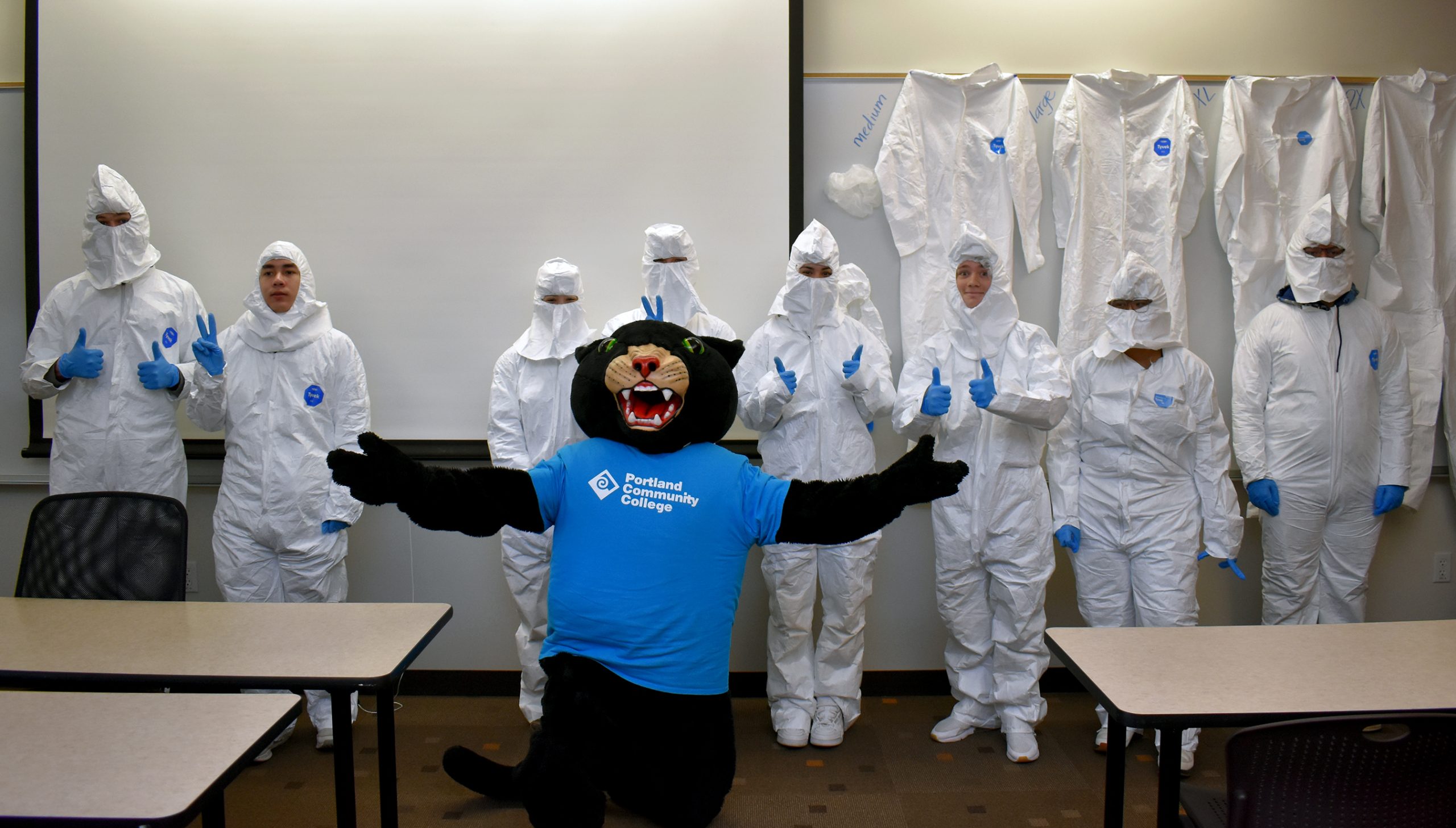 Poppie with students in bunny suits.