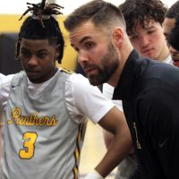 Cameron Mitchell coaching during a timeout.