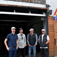 Migration brewing co-owners enjoy a moment outside at Glisan location.