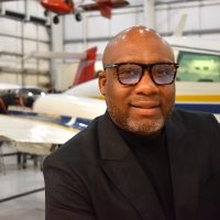Josh Coleman at the aviation hangar at Rock Creek Campus.