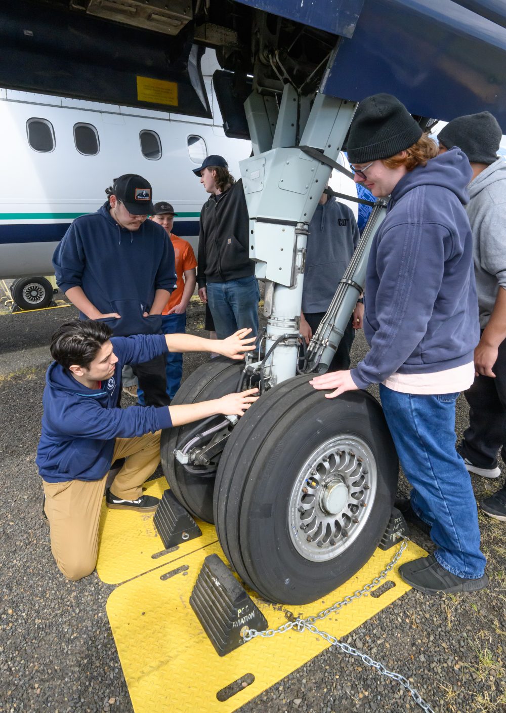 Students inspect landing gear