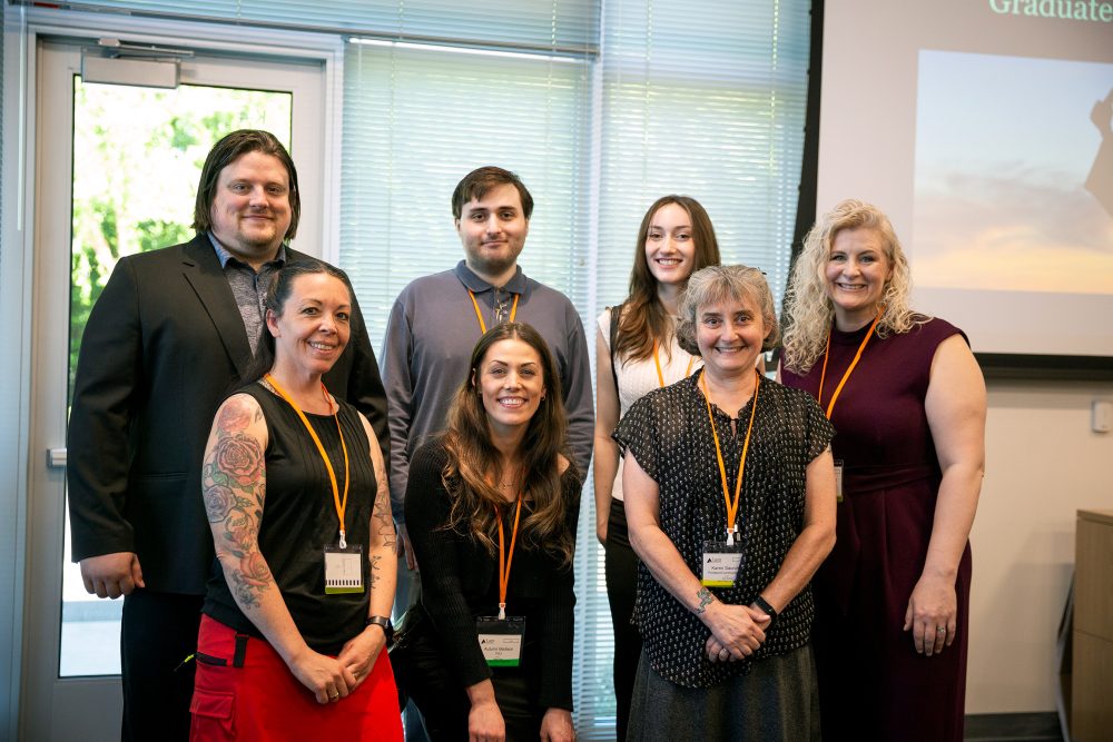 Front row, PCC's Windy Wahlke, PSU's Autumn Morrison and PCC's Karen Sanders pose with microscopy graduates.