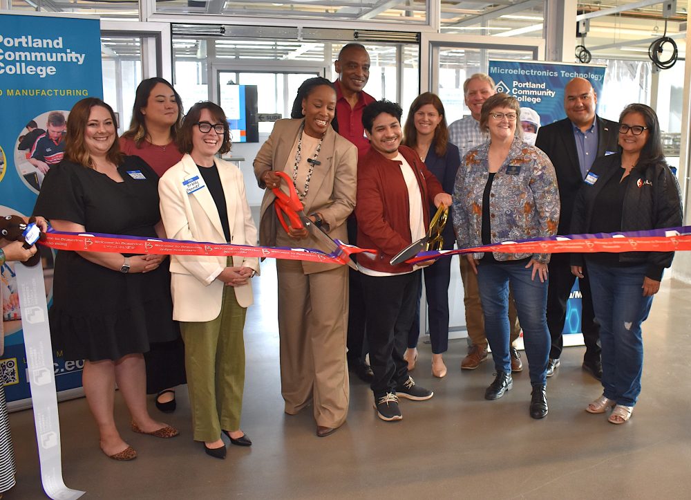 Group ribbon-cutting in new Teaching Cleanroom at Willow Creek Opportunity Center.