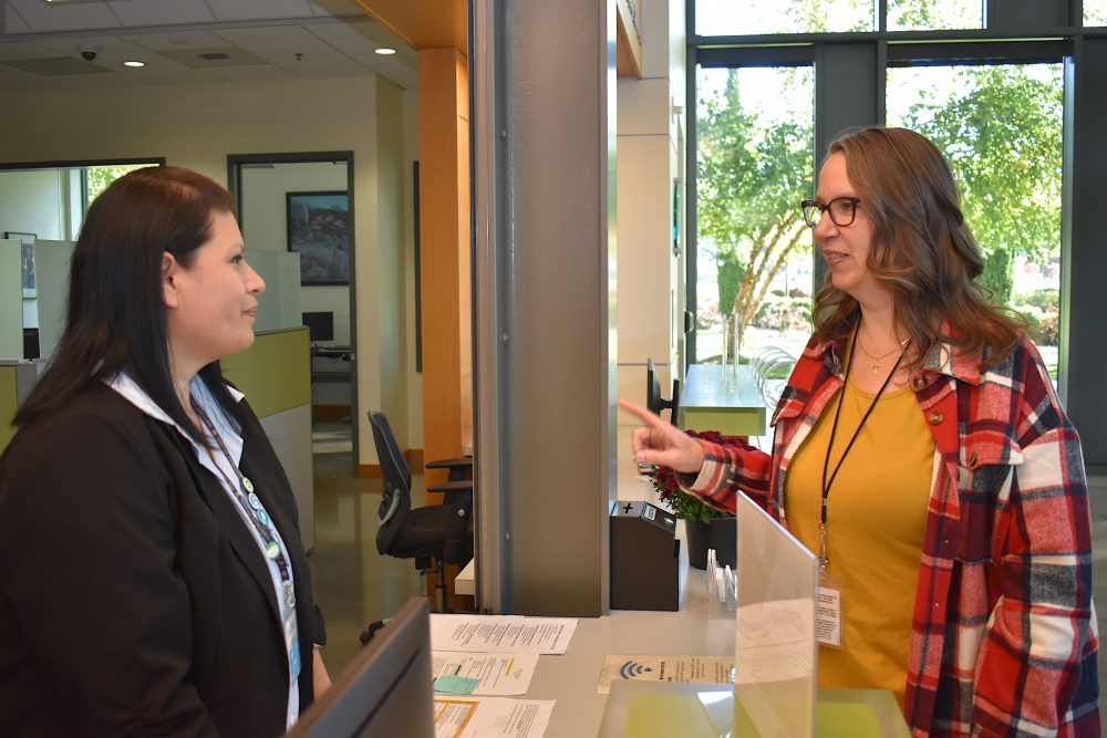 Amber Bliss Calderón (right) is proud of how the Newberg Center serves the local community.
