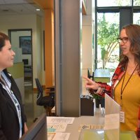 Amber Bliss Calderón (right) is proud of how the Newberg Center serves the local community.