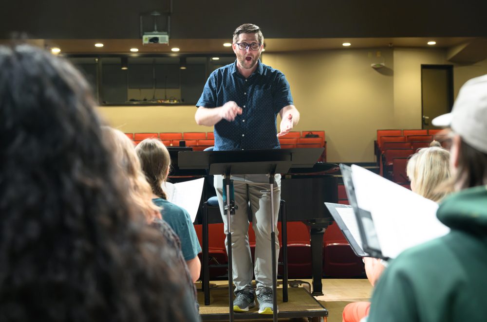 Sam Barbara conducting choir practice.
