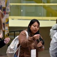 customer looking at a necklace