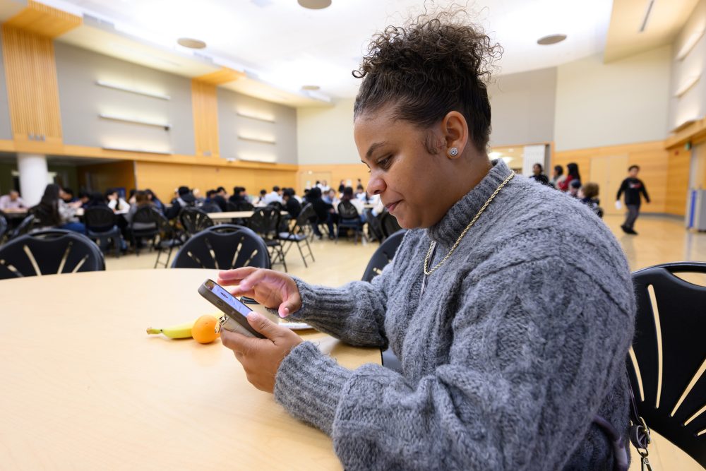 Chantell Wesley sitting at table at the ethnic studies conference at PSU