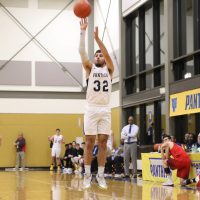 #32 in white B-Ball uniform shoots.