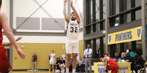 #32 in white B-Ball uniform shoots.