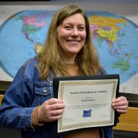 Rachel Skinner holding her certificate