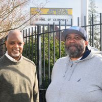 Tyrone White and Tony Broadous in front of Jefferson HS.