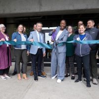 Ribbon cutting with Adrien Bennings and Rep Daniel Nguyen and guests