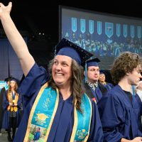A graduate celebrates.
