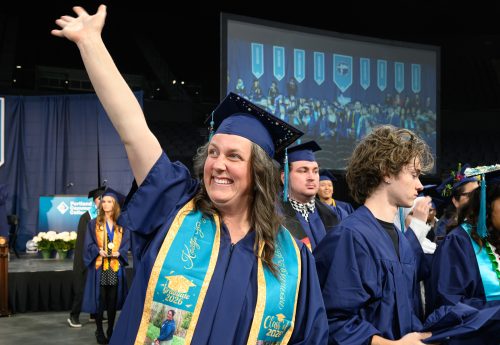 A graduate celebrates.