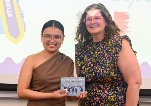 Heredia Cepeda is celebrated by OISS Director Alicia Adams during the annual International Education Completion Ceremony.