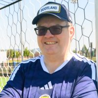 John MacLean in front of soccer goal net.