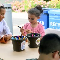 Kids working on arts and crafts.
