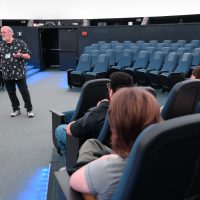 Todd teaches his class at OMSI's planetarium.