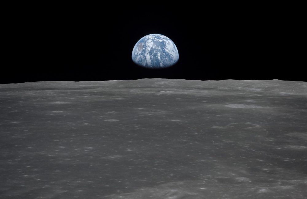 View from the Apollo 11 spacecraft shows Earth rising above the moon's horizon in 1969. Courtesy of NASA.