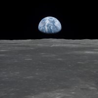 View of Earth from the Apollo 11 spacecraft shows Earth rising above the moon's horizon in 1969. Courtesy of NASA.