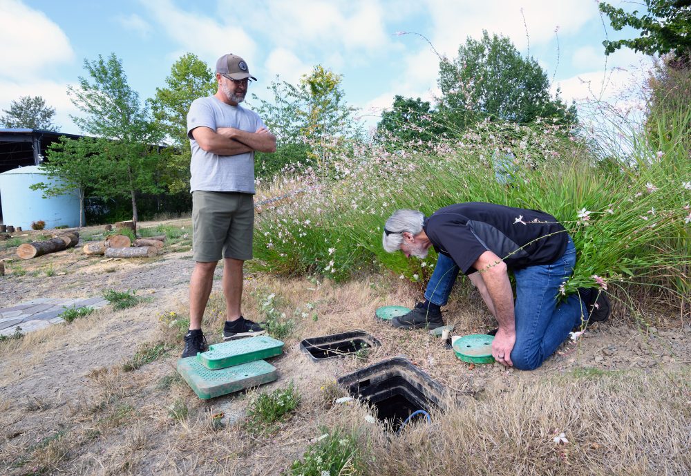 Gordon Kunkle, an instructor with PCC’s Professional Development and Training Program, inspects an irrigation system for his workshop at the Rock Creek Campus.
