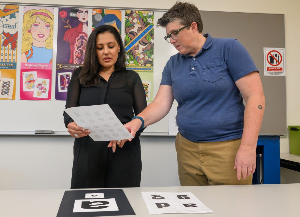 PCC Graphic Design 120 Instructor Aubree Holliman reviews portfolios and prepares students like Sonia Yemane-Berhane for entry into the Graphic Design program.