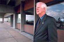 Dan Moriarty looks on.