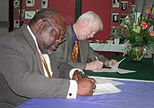 Moriarty and Bernstine sign.