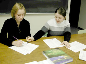 Tanya Rusnak and Yelena Markovtsiy review an assignment.