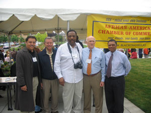 African American Chamber of Commerce (AACC) President Roy Jay (center), with, left to right, AACC member Joe Nunn, Portland Mayor Tom Potter, District Attorney Michael Schrunk and Cascade Campus President Algie Gatewood.