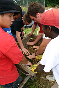 Duc Ho helps make plaster.