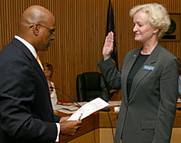 New Board Chair Doreen Margolin gets sworn in by PCC District President Preston Pulliams.