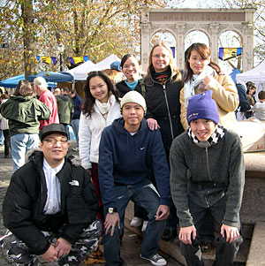Penny Thompson (center, backrow) led a group of international students on a tour of Saturday Market.