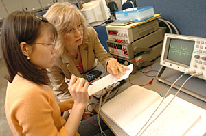 Dorina Cornea-Hasegan, right, works with a student in the microelectronics lab