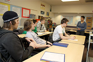 Tonya Booker chats with the Winter Hawks during her customized life skills class.