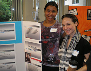 Cascade Campus students Maya Noble, left, and Marissa Mojica show off their research projects at the William Temple House in Northwest Portland.