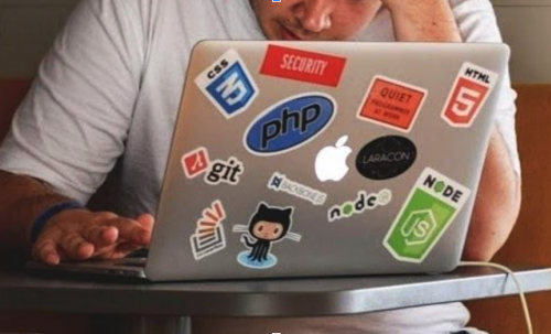 a frustrated student working on a laptop