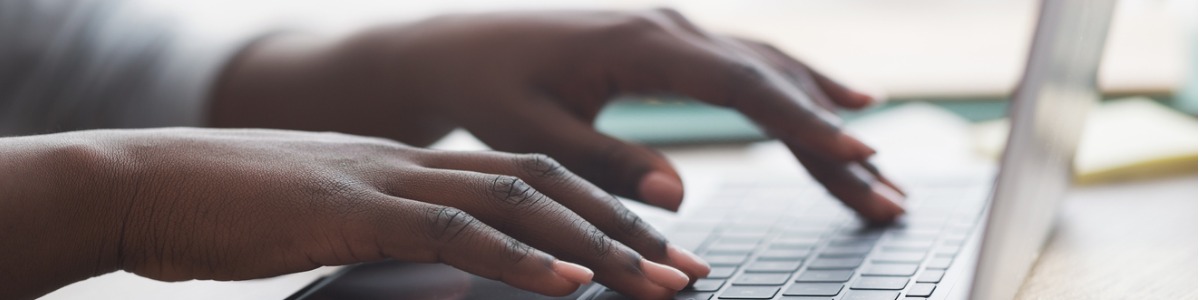 hands on a computer keyboard