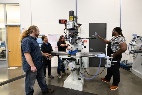 Classmates at machine