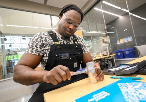 Student measuring in classroom