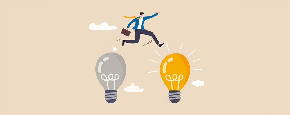 Graphic of a businessman jumping between an unlit lightbulb and a lit lightbulb