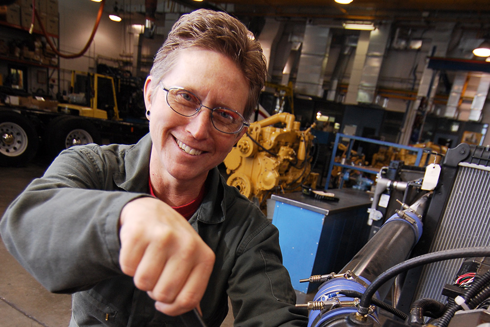 Diesel Service student working with a wrench