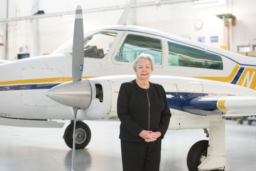 Pat Reese in front of an airplane