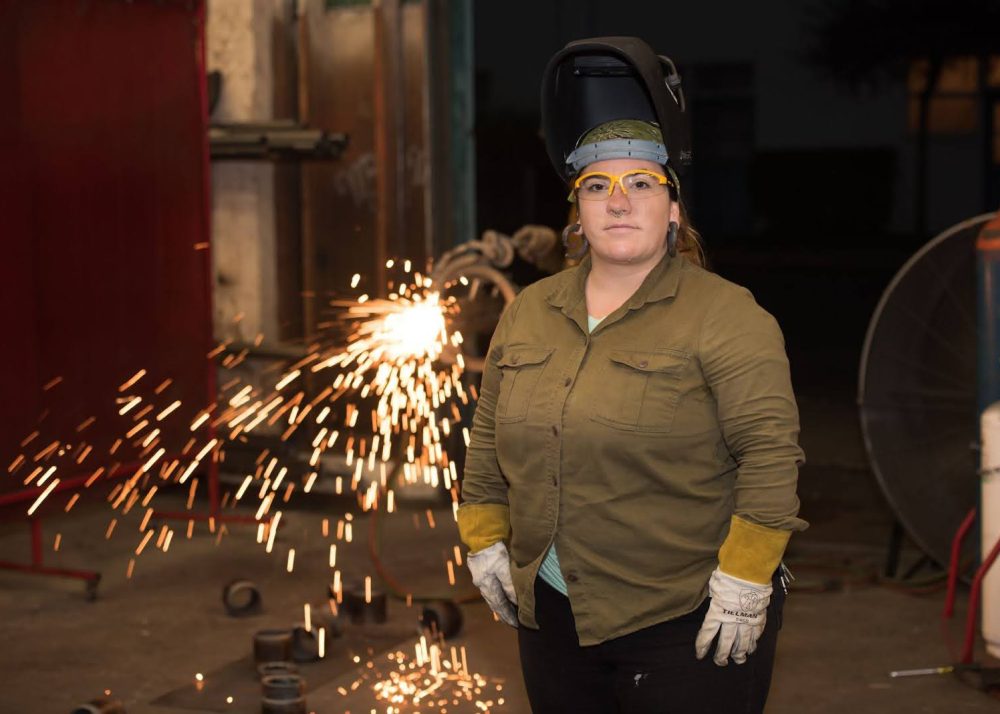 welding student with a shower of sparks