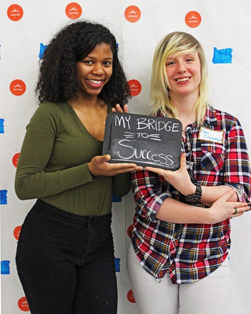 Students holding a sign that says my bridge to success