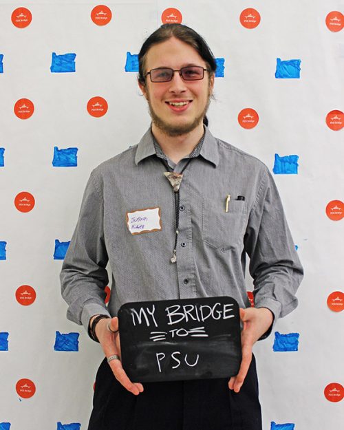 Student holding a sign that says my bridge to PSU